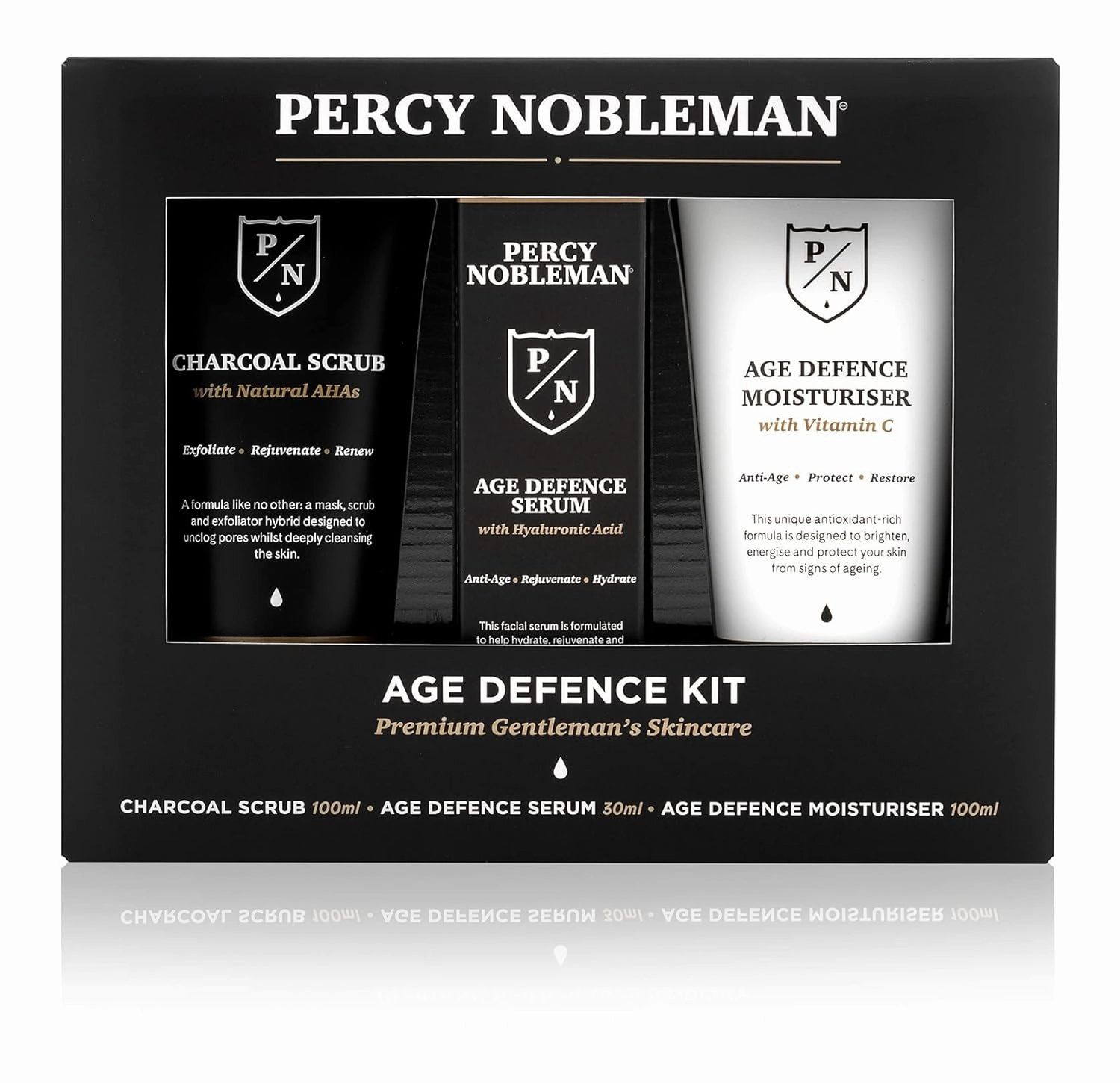 Age Defence Kit, a men's skincare set containing Charcoal Face Scrub (with Natural AHAs), ultra-hydrating Facial Serum (with Hyaluronic Acid), and Moisturiser (with Vitamin C)