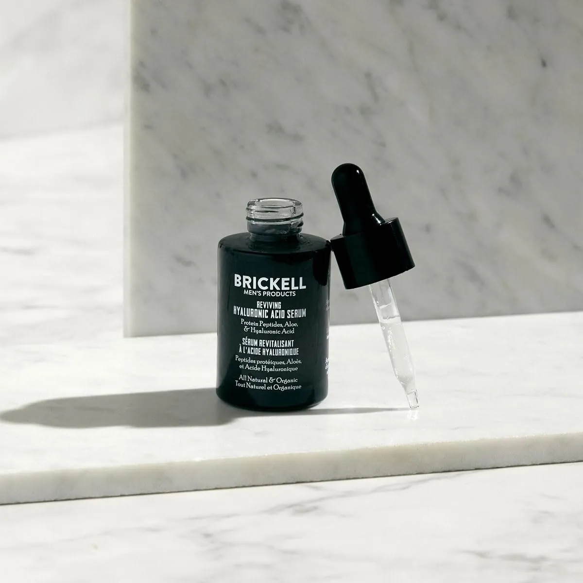 Brickell Men's Anti Aging Hyaluronic Acid Serum for Face, Reviving Day Serum for Men, Natural and Organic with Protein Peptides to Restore Firmness and Collagen, 1 Ounce, Scented